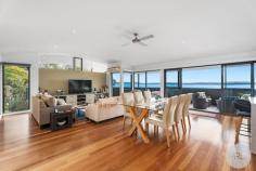 15 Kallaroo Street Corlette NSW 2315 $2,400,000 Situated a short 300m walk away from the glistening shores of Corlette Beach, this exquisite house offers a truly enviable beachside lifestyle. With a perfect northern orientation, the architecturally designed and quality-built home bathes in natural sunlight and enjoys refreshing ocean breezes year-round whilst providing the opportunity to live on the one level. The striking modern exterior hints at the modern luxury and comfort that awaits within. As you step inside, you are immediately drawn to the captivating water views that beckon through expansive and carefully placed array of glass windows and doors. Greeted by the warmth of timber flooring throughout, the neutral interiors create a soothing ambiance that complements the coastal surroundings. The heart of the home boasts a sleek kitchen adorned with crisp & modern cabinetry, quality stone benchtops and cooktop. Miele appliances make cooking a pleasure, while the timeless, open layout ensures seamless interaction with guests and family. The master suite and garage is also located on the main floor allowing you the opportunity to live all on the one level. The balcony presents an ideal setting for entertaining, where you can soak in the views while hosting gatherings, enjoying a morning cup of coffee and book or simply unwinding after a fun-filled day at the beach. This thoughtfully designed home accommodates four spacious bedrooms, each designed with comfort in mind plus a study. The residence also offers a second living room downstairs which could also be used as a fifth bedroom. The main bedroom, a true retreat, treats you to expansive water views and features a private ensuite adorned with a large bath that invites you to indulge in a relaxing soak after a long day. Modern elegance meets practicality with the addition of a generous storage area on the lower level, providing ample space for your belongings. Whether you're looking to store beach gear or household items, this feature adds a layer of convenience to daily living. In addition to this, a double remote garage provides secure parking for your vehicles. Other features include the 'Green Credentials', the perfect northern aspect of the home in conjunction with an efficient 'Rheem Heat Pump' Hot Water System meaning that the home requires less electricity to be used, therefore your electricity bills are kept to a minimum. Outside, the established, easy cared gardens offer a serene backdrop, inviting you to connect with nature. The property's unique positioning, backing onto a reserve, ensures a peaceful and uninterrupted outlook, allowing you to revel in a sense of tranquillity that's truly rare. Experience the epitome of coastal living in a location that combines proximity to the beach with the tranquillity of reserve-backed living. This house offers not just a home, but a lifestyle-one where every day is a beach vacation and where the comforts of modern living merge seamlessly with the beauty of nature. Do not delay or you will be disappointed. Please contact Dane Queenan on 0412 351 819, Tristan Esquilant on 0435 642 942 or Erin Sharp on 0400 560 067 to receive a full information package including recent sales, rental appraisals, pest & building inspection reports and contract for sale. 