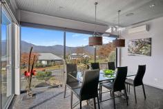  28 Fiddleback Drive Tawonga South VIC 3698 $1,500,000 - $1,600,000 Positioned in a picturesque Victorian High-Country valley is this extraordinary and ultra-modern home offering extensive unimpeded views of Mount Bogong and the Upper Kiewa Valley. This industrial themed and architecturally designed home features three bedrooms and two bathrooms with high end finishes, privacy, and elegance. Containing all the practicalities of modern living this property is set to impress and accommodate the demands of a wide range of purchasers. The breathtaking use of natural elements combine in a low maintenance front garden where slate stone flows featuring a dry creek bed with a modern fountain and gabion pillars which can be illuminated at night. An innovative above ground steel walkway reminiscent of a ski resort brings you to the remarkable entrance with a grand front door that welcomes you to this masterpiece of contemporary design unrivalled in scale, level of finish and sheer quality, this spectacular residence is unforgettable. This warm, luxurious tri-level home features extensive open plan living and is a banquet of bespoke design and detail with an industrial atmosphere comprising a lounge, kitchen, dining area and mezzanine above, all with stunning views of the surrounding countryside. The kitchen features top of the line appliances including an induction cook top on the large triangular island bench which has attached a glass breakfast bar. There is ample storage space in the kitchen with walk-in pantry, making it the perfect place for cooking and entertainment. The delightful adjacent dining area has an abundance of natural light from floor to ceiling tinted windows but transforms into an intimate and cosy dining area at night. Additional to the classic living areas there is a spacious upstairs mezzanine utilised as a sitting room offering spectacular unobstructed 180-degree views, day and night, of the Kiewa valley, Mount Bogong and the nearby township of Mount Beauty. A wonderful spot to sit and read a book or simply relax and drink in the view. Designed for grand scale alfresco entertaining the pool pavilion houses a heated 5-person spa, heated swim-jet pool with covers and a TV, perfect for all weather entertaining and being completely protected from the elements. The covered alfresco has an inside and outside counter connected to the kitchen by a bi-fold window to allow a seamless transition from indoor to outdoor living. It is an area that truly inspires and provides year-round poolside entertaining and an unparalleled lifestyle. The master bedroom is at the rear of the house and continues with the industrial and contemporary theme. Featuring a full room width, double access walk-in robe, an adjoining ensuite bathroom and large floor to ceiling windows looking out from the bedroom and ensuite over the large trees surrounding a flowing creek on the acreage behind the house. The subsequent two bedrooms are also substantial in size and have full width built-in robes. The third bedroom at the front of the house features large floor to ceiling window with spectacular views of the mountains. It is presently set up as a fully functional office/study but could be utilised as a bedroom if desired. The lowest level of the property is the most intricate containing a large workshop, garaging for 3 cars, a pool utility room containing washroom facilities and a room used as a garden shed with a separate entrance, all with concrete flooring and extensive built in cabinetry for storage facilities. Adjacent to the rear garage entrances is a large bituminous yard with ample space for a caravan, motor home or boat. The elegant gardens are low-maintenance with compact fruit trees and are auto drip irrigated for convenience. Additional features include, but are not limited to: • 	 Double glazed windows throughout with large windows being lightly tinted with heat reduction and privacy film. • 	 Instant hot water tap to a kitchen sink • 	 Insinkerator in one kitchen sink • 	 Professional reach and pull-out kitchen mixer tap • 	 Extensive LED lights throughout • 	 30 solar panels with Tesla lithium battery backup • 	 Home security alarm with outside video security cameras • 	 Comprehensive audio-visual system with speakers and TV outlets throughout • 	 2x 6000litre rainwater tanks with submersible pump supplying water to toilets, laundry and some garden taps • 	 Solar hot water service • 	 Remote controlled automatic sliding gate to driveway entrance • 	 Front bitumen driveway has additional off-street parking space • 	 Garden shed under side of house • 	 Large unused areas under floor of living area with potential for additional usable spaces for rooms or storage • 	 Secure quality fencing for privacy The residence is situated on a small new estate with modern all underground services. The estate is 3km from Mount Beauty and is set in the middle of farmland and small acreages and is a mere 45 min drive from the snow at Falls Creek Ski Resort. The rural township of Tawonga is situated in the Kiewa Valley, North East Victoria in the Heart of the High Country. Tawonga is renowned for its majestic landscape and is central to a variety of recreational activities including fly fishing, horse riding, camping, water sports, downhill and cross-country skiing, snowboarding, golf, tennis, and mountain biking, bush walking, gliding, private aviation or simply absorbing nature. The region also boasts award winning restaurants and vineyards. The exterior of this property presents unique quality architecture, while the memorable interior spaces show an incomparable combination of sophistication, cutting edge design, and spectacular attention to details. 