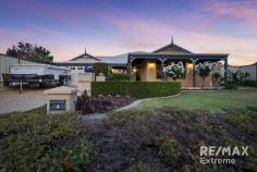  4 Danja Rise Hocking WA 6065 $800,000's WOW! Properties like this rarely come to market! This stunning 4-bedroom 2-bathroom residence ticks all the boxes & then some! Boasting a resort style below ground pool, double workshop & a huge 902sqm block, this residence is truly special. Features & benefits include: * Entrance hall * Study / home office with ceiling fan * Home theatre / formal lounge & dining * Master bedroom suite with walk in robe, reverse cycle, split system air conditioning, sliding door to a courtyard & ensuite with twin vanities with stone bench top, floor to ceiling tiling, shower with 2 shower heads & WC * Open plan family, meals & games areas with reverse cycle, split system air conditioning * Kitchen with breakfast bar, feature vaulted Velux window, pantry, double fridge / freezer recess, dishwasher & shoppers’ access from the garage * 3 further bedrooms with ceiling fans — 1 with sliding door robe * Family bathroom with bath, shower with 2 shower heads, floor to ceiling tiling & vanity with stone bench top * 2nd WC * Fitted laundry with 2 double door linen/broom closets * Wood flooring * CCTV * Crimsafe security screens on all doors & windows * Windowsills * Skirting boards * Large, undercover entertainment area with ceiling fans & lighting * Downlights under the eaves * Generous grass area for the kids & pets * Sparkling below ground pool with thatched umbrellas with lighting * Established, landscaped gardens * Garden lighting * Rainwater tank * Large, powered workshop with 3 phase power, side access through 2 roller doors, electric hand drier, rear access from the back garden & plenty of secure parking & space for cars, trailer, boat etc * Sink with hot & cold water for descaling fish / cleaning up * Double, remote garage * Huge 902sqm block * Within walking distance of Hocking Primary School, transport, Wyatt Grove Shopping Mall & St Elizabeths Catholic Primary School & close to parks & all other local amenities For further information & to arrange your viewing of this once in a lifetime property, contact Team Demo today! 