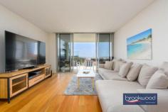  Unit 5/5 Reserve St Scarborough WA 6019 $825,000 Steps from the iconic Scarborough beach, this luxury second-floor apartment gazes out to the Indian Ocean, a symphony of changing colours and moods. High-spec finishes, including oak floors and Miele appliances, an open plan design that melds into a wide balcony overlooking the sea and a small complex with a communal pool, gym and sauna come together to deliver boutique living steps from the rejuvenated promenade and 15 kilometres from Perth CBD. 2 bedrooms 2 bathrooms 2nd-floor corner apartment Huge balcony ocean views Oak floors Miele appliances Pool gym and sauna onsite High ceilings double glazing Secure complex UC parking 2 bays Intercom system & CCTV security Oceanside boutique complex Winner 2015 MBA Award – Best built apartment building in WA Steps from the azure waters of Scarborough Beach and the vibrant array of restaurants, bars, and entertainment along the revitalised promenade, this sophisticated oceanside apartment epitomizes the quintessential indoor-outdoor lifestyle. Its open-plan living seamlessly extends to a spacious balcony, offering panoramic vistas of the Indian Ocean. Positioned on the second floor and occupying a coveted corner spot, the apartment employs lofty ceilings, expansive full-height windows, and a predominantly white palette to craft a refined living experience within a secure boutique complex. Oak flooring, sumptuous carpets and gleaming white stone surfaces accentuate the spectacular light of the coastal setting. The thoughtfully designed, impeccably appointed kitchen delivers ample inspiration for at-home, oceanside dining and entertaining with an electric oven, induction cooktop, dishwasher, ample storage and a sleek stone countertop. Tucked discreetly to the rear of the kitchen, a stylish European laundry adds to the convenience of modern living. Both bedrooms boast fitted built-in robes and soft carpet underfoot. The main bedroom boasts a fitted walk-in robe and modern ensuite with shower vanity and WC. The second bedroom has a built-in robe and accesses the family bathroom, a well-appointed space with shower, vanity and WC. Double glazing, ducted reverse cycle air conditioning, fobbed access, intercom and CCTV ensure exceptional comfort and convenience. Undercover parking for two cars, a storage unit, an on-site sauna, gym and pool add to this apartment’s long list of amenities and deliver the ultimate oceanside home. 