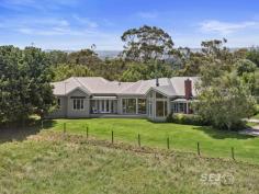  75 Arnolds Road Koonwarra VIC 3954 $1,850,000 - $1,920,000 Prepare to fall in love as you meander the curved tree-lined driveway, to discover this contemporary Victorian-style country home. Built in 2009, this quality architecturally designed home, is situated on approximately 3acres, overlooking much larger rural properties, with uninterrupted panoramic views across the Tarwin Valley, as far as Wilsons Promontory. At the end of a country lane, it is secluded, private and quiet, with abundant bird and native wildlife creating the only "noise". The family, dining & kitchen are the heart of the home. Spacious, flooded in natural light, with Tasmanian Oak timber floors, and the centerpiece Cheminées Philippe double sided wood fire set in Mount Angus Sandstone. Comprising of a country style kitchen with beautiful blackwood bench tops, quality appliances, and walk in pantry, an expansive dining space with 4m pitched roof and soaring glass picture windows, and comforting family lounge. The east wing, wrapped by the charming veranda, includes a classically styled formal lounge, and across the wide hallway you will find the master suite with spacious walk-in robe, ensuite complete with deep bath set in bay window, walk in shower, and separate toilet. The additional three queen size bedrooms are located in the west wing, each with generous built in robes, desks and spectacular views, with their own rumpus/ third living room, which has direct access to a north facing deck and is bathed in natural light. The family sized bathroom, separate powder room, & enormous laundry with direct under cover access to garage are also in this wing. Storage throughout the house is plentiful, including a custom storeroom. Established trees throughout a low maintenance garden including vegetable garden with raised beds, numerous productive apple, and citrus trees. and the tree lined driveway with ornamental Manchurian Pears providing 4 seasons of spectacular displays. Quality boundary and internal electric fencing, currently divided into 3 paddocks, which has until recently, serviced a horse and 2 companion sheep. Ideally suited to small flock of sheep and/or a horse or two. Separate 5 bay shed (18m x 7.5m) ideal storage for all your toys, boat, caravan, or horse float. 90,000L water tank storage providing ample water for the residence & property. 1500metres to the Great Southern Gippsland Rail Trail, 6mins to Meeniyan, 10mins to Leongatha, 20mins to Inverloch, and an easy 90min to SE suburbs of Melbourne. This exceptional country home is a rare gem in a magnificent location. If you have been searching for a modern, stylish country residence, then this is most worthy of your consideration. 