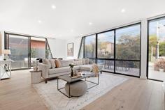  1/251 Riversdale Road Hawthorn East VIC 3123 $1,650,000 - $1,750,000 This impeccably designed townhouse, located in the sought-after Hawthorn East area, boasts a blend of style and functionality, perfect for modern living. With its striking exterior and private entrance, the property radiates sophistication. Inside, the spacious layout seamlessly connects indoor and outdoor areas, ideal for entertaining or enjoying quiet relaxation. The ground floor features an open-plan living area that flows onto two paved terraces, complemented by a well-appointed marble kitchen equipped with high-end Miele appliances. Additionally, this level includes a laundry, powder room, and storage space for added convenience. Upstairs, two generous bedrooms offer urban views from a shared terrace, alongside a stylish central bathroom. The master suite occupies the top floor, providing a private oasis complete with ensuite, walk-in robe, and a large terrace with suburb-wide vistas. Premium features such as oak flooring, ducted heating and cooling, ample storage, and secure parking for two cars enhance the home's appeal. Positioned just moments from public transport, Riversdale Village, and prestigious schools like Scotch and St Kevin's Colleges, residents can enjoy the convenience of city living. Nearby Camberwell Junction offers a variety of shopping and dining options, while Fritsch Holzer Park provides a tranquil retreat for relaxation. This exceptional residence offers the epitome of contemporary living in a highly desirable location. 