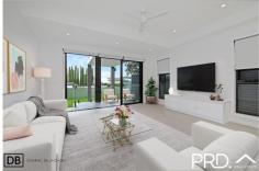  2A Gracemar Avenue Panania NSW 2213 $1,498,000 Architecturally designed with a focus on space, natural light and luxury, this beautiful home built by Arkitek Projects delivers the very best in low maintenance indoor/outdoor living. It enjoys a whisper quiet Panania South cul-de-sac location and is within an easy walk to Panania shops and station. Property Flyover: - Free flowing, open plan design with high ceilings. - Beautiful stone island kitchen features premium gas cooking and pantry. - Three large bedrooms all with built-in robes. - Master suite features a walk in robe, ensuite and balcony. - Contemporary bathrooms; main with freestanding bath & double vanity. - Living/ dining easily transitions to a generous covered outdoor alfresco, perfect for entertaining. - Level north facing, child-friendly backyard. - High ceilings, ducted air conditioning and alarm system. - Single lock up garage with internal access plus off street parking. - SUPER rare additional side access with double gates, perfect for boats, caravan, or extra storage. 