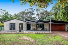  16 Fletcher Road Lesmurdie WA 6076 $989,000 Set in this PEACEFUL & QUIET location overlooking beautiful Seaton Park (with its pretty creek, walk trails, playground), is this beautifully renovated & immaculately kept 4-bedroom 2-bathroom brick home on a MINIMAL CARE & fully landscaped 1,503m² block. Featuring 2 separate living areas, a galley-style kitchen with granite bench-tops & generous cupboard storage spaces, good-sized bedrooms, a massive alfresco area complete with a built-in barbeque area & fire pit, this gorgeous property will suit a myriad of buyers: Those who love to entertain - huge alfresco area and the landscaped gardens provide a beautiful backdrop for those larger parties / family gatherings; The young family - plenty of lawned area for the kids to play and there is also the playground across the road! The family with older kids - the master bedroom is conveniently located at opposite ends of the house from 2 other bedrooms, with parking space for additional cars. The downsizer - for those of you looking to downsize to a smaller & easy-care block but not wanting to compromise on the size of the house. There is absolutely no work required here - just move in and enjoy all that this gorgeous property has to offer. So call Emily Tan or Angela Padula now to view & secure this gorgeous property! Property Highlights: beautiful timber-look flooring 4 great-sized bedrooms 2 bathrooms formal lounge overlooking the park open-plan family, dining & kitchen galley-style kitchen with granite tops, dishwasher, 900mm oven & pantry massive alfresco area shaded area at the front of the house for relaxing & enjoying park views reverse-cycle air-conditioning slow-combustion wood heating a 3.85kW photovoltaic system (solar panels) security system 3 garden sheds landscaped & terraced backyard with built-in fire pit & seating double garage (with extra height clearance) additional parking space for a caravan or boat 1,503m² minimal care block great central location, within an easy walk to shops and public transport, and close to local schools including St Brigid's College and Kalamunda Christian School approximately 15km to Perth airport and 25km to Perth CBD 