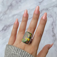 Discover the vibrant spectrum of the colors in a rainbow in Sagacia's  Statement Ammolite Rings  . These dazzling jewelry pieces, made using 100% natural and genuine ammolite and set in pure 925 sterling silver that is also hypoallergenic in nature, showcase an array of brilliant hues that tend to change and shift with every movement. The ammolite gemstone is well-known among Meditation and Mindfulness Practitioners for its connection to ancient wisdom and this gemstone is a stone that brings prosperity, transformation, and positivity to the wearer. Handcrafted with care and precision, our Statement Ammolite Ring automatically makes a bold impression, drawing admiration from the audience. We recommend that you wear this ring when you wish to add a tinge of elegance and mystery to your outfit. So, purchase the Sagacia Statement Ammolite Ring and let this radiant beauty remind you of the endless possibilities that life offers.