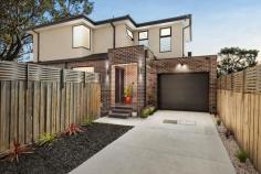  2/59 Moreton Street Frankston North VIC 3200 $690,000 - $735,000 Meticulously designed to embody a sophisticated yet low-maintenance lifestyle, this impressive three-bedroom 3-bathroom residence is a true celebration of effortless living. Just doors from Armata Park Playground and a few blocks from Aldercourt Primary School, the modern home caters to a pedestrian lifestyle with both public transport and local shops within easy reach of home. Showcasing a strong focus on quality craftsmanship and stylish design, the dual-storey layout offers thoughtfully curated spaces that cater to both couples or young families, alike. Expansive, light-filled proportions and 2.7m ceiling heights define this adaptable layout, where a statement timber staircase with glass balustrade elegantly connects a first-floor retreat with a spacious ground-floor social domain. The heart of the home is a generously sized kitchen, complete with premium appliances, stone waterfall benchtops, and exceptional storage. Three well-appointed bedrooms each with high-density carpet, and three bathrooms flow across the two levels, including the master suite that continues to emphasise the home's abundant natural light. This spacious retreat features a walk-in robe and a dual vanity ensuite with full-height tiling, while additional features include split-system heating and cooling, double glazed windows, security cameras (x7), alarm system, hybrid flooring (living area), low-maintenance gardens with discreet shed and water tank (supplying toilets), generous laundry and oversized single garage with storage space. Positioned only moments from Frankston's major retail and Seaford Beach, with convenience to Monterey Secondary College, choice in primary schools, and freeway access. 