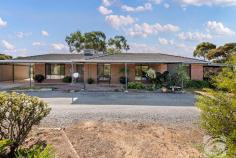  34 Dublin Rd Mallala SA 5502 $849,000 - $899,000 Nestled on a sprawling 2.94 acres (approx.), at 34 Dublin Road, Mallala, seamlessly combines country living with modern comforts. The main house features three spacious, carpeted bedrooms with built-in robes, adding plenty of storage. The floating floors throughout the home, a wide entryway, and a formal lounge create an elegant and welcoming atmosphere. The recently renovated kitchen is the heart of the home, overlooking an open-plan meals and family area ideal for daily living and entertaining. For added comfort, a combustion heater warms the space during cooler months, while ducted evaporative air conditioning ensures year-round comfort. A renovated laundry and bathroom further enhance the home's appeal. A unique feature of this property is the self-contained granny flat under the main roof, which offers privacy and independence. It includes a modern kitchen, living area, bathroom, gas heating, and a reverse cycle split system, making it perfect for extended family or guests. The outdoor area is perfect for those who love the outdoors or need space for horses, boasting established gardens, including a veggie garden. The outdoor entertaining area with a bar is ideal for social gatherings. The property is equipped with two rainwater tanks, a solar system, a double carport, a garage, and multiple sheds for storage, wood, and craft. Whether you're looking for space for a growing family, have a passion for gardening, or are seeking a taste of country living, this Mallala property is sure to impress and is in an ideal location to live with your parents. So jump in your car, it wont disappoint. 