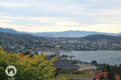 EXECUTIVE/FAMILY HOME WITH PANORAMIC HARBOUR VIEWS FOR SALE - $795,000+ It is indeed a treat to live in Hobart and be able to enjoy one of the most amazing views in the world. Every room in this executive home enjoys a spectacular outlook, which encompasses the City, Casino, harbour, iconic Tasman Bridge and Eastern Shore as far as Bruny Island. This really is something special. The sun streams through the windows making the home light, bright and (most importantly), warm. The benefit of the Northerly aspect is maximized with a deck (with automated "Vergola") extending from the main living room and master bedroom, together with a balcony extending along the front with sliding glass doors from the informal family room. The hub of most homes is usually the kitchen and here, there's a sparkling white kitchen with black granite benches for the family chef to enjoy. With plenty of storage and preparation space, and having informal meals and family areas adjoining, you'll always feel involved with family and friends as you prepare the next culinary delight. Ideal for a family, this home offers 5 bedroom accommodation. The master bedroom enjoys a walk-in robe and ensuite, together with access through glass doors to a deck. It would be hard to think of a day where you wouldn't wake up feeling on top of the world, when you have the panoramic views offered here to wake up to! With both formal and informal rooms together with decks for entertaining, one would think that everything had been taken care of, but wait, there's more! An indoor natural-gas heated pool and gymnasium offer year-round fun and fitness opportunities for your family and, if you feel like relaxing in front of a great movie, the media room is just the place for you to snuggle up with pop corn or an ice cream and escape for a while.  Built with ease of living and comfort in mind, other features of this home ducted reverse-cycle air conditioning, ducted vacuum system and intercom system throughout, together with underfloor heating in the main bathroom downstairs (together with 1 bedroom) and throughout the entire first floor. Outdoors is a small, low maintenance garden with a range of fruit trees and some beds awaiting you to grow your own vegetables. In close proximity of schools, UTas, shops and services and just 6-8 minutes from the city, this is an executive home of generous proportions and enjoying a spectacular harbour vista. We'd be delighted to show you through on a personal inspection, so please call Michael or Jill to schedule a suitable time. PROPERTY OVERVIEWProperty ID:3P1612Property Type:HouseLand Size:559m² approx.Building Size:341m²Garage:2Car Space:2Inspection Times:As Advertised or by Appointment 