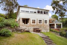  70 Loftus Street, Bundeena NSW Iconic Beach House One of the first houses built in Bundeena, this iconic sandstone-based house has stunning northerly views across the Hacking to the city which can never be built out. Recently renovated, with two bedrooms and a bathroom, there's still loads of scope to expand into the downstairs area which is currently used for storage. Situated a short walk from the shops, ferry, club and Horderns and Gunyah beaches, the location is truly stunning. At the back there's a garden and barbeque area with outdoor shower, perfect for entertaining after returning from a day at the beach. As a holiday rental, you could make around $300 per night, and be able to use the cottage yourself whenever you want to get away. As a home, there's no better place to live than Bundeena, where the community and lifestyle are are second to none. Your own beach pad in "the Palm Beach of the South", plus an income? What are you waiting for? You'll be waking up to the sound of the sea before you know it 