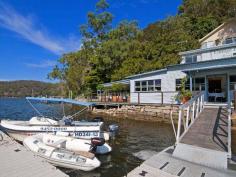 2 Anderson Place, Cottage Point NSW ottage Point Inn Restaurant & Apartments - Freehold For Sale Set in a location without comparison, is this famous waterfront restaurant/landmark - an institution amongst knowledgeable diners across Sydney and the world for over 30 years. This is an exceptional opportunity for an investor or entrepreneur to purchase one of the Hawkesbury's most exciting waterfront estates in a key location only 50 minutes from the CBD. The Cottage Point Inn Restaurant, set on the water at the junction of Cowan Waters and Coal & Candle Creek, was originally the Cottage Point boatshed and general store. The building was converted to a restaurant in the 1970s and has been operating since. Set directly behind the restaurant are two separate, fully self-contained apartments or cottages, which are included in the restaurant lease. Features include: - 5+5 year lease signed in 2012 by the tenant for restaurant and apartments - Income of $308,885.42 per annum (inclusive of GST) - Rent is indexed at CPI annually - Tenant pays 100% of outgoings (as defined in the lease agreement) - Tenant has over 30 years history of ownership and management of the restaurant and apartments - Improvements on the title include the Cottage Point Inn Restaurant building with substantial waterfront terraces, commercial kitchen, inside dining, air conditioning & his and her's bathroom - Substantial and wide waterfrontage - Floating deepwater pontoon for seaplanes and large boats - Office or flat above the restaurant with two rooms and bathroom - Two apartments set behind the restaurant - Both apartments have wide 180 degree views of magnificent Cowan Waters and Ku-ring-gai Chase National Park - Cottage one "Cowan Waters Apartment" is a self-contained apartment with full kitchen facilities, large dining and lounge area, private balcony, separate double bedroom, spa bath and reverse cycle air-conditioning - Cottage two "Riverview Suite" is equipped with breakfast bar, private balcony, lounge area, well-appointed bathroom & reverse cycle air-conditioning - License agreement (sub leased to the restaurant tenant) with National Parks and Wildlife services for the use of the land that sits over the high water mark - Access to the restaurant is by road, boat, ferry or seaplane   Property Snapshot   