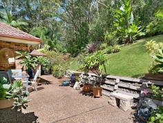 194 Empire Bay Drive, Empire Bay NSW Country feel with a Coastal lifestyle This stunning North-facing home on just under an acre features an easy-care well-maintained garden and enviable privacy and position. The land is gently sloping, which provides an elevated site and tranquil outlook for this superbly maintained home. The owners have kept this property in pristine condition. Purpose built to provide in-law accommodation, the main home offers two bedrooms, one bathroom, a modern kitchen and family rooms. The in-law accommodation features a double bedroom with ensuite, lounge room, a kitchenette/wet bar area, and own entrance. With all this accommodation under one roof, the new owners will have the choice between taking advantage of the vendor's shrewd set-up. Featuring air conditioning, an alarm system, a workshop, a double automatic garage, a large paved entertaining area as well as natural bushland, this home is sure to impress the astute purchaser. Positioned close to beaches, schools, shops, and boating facilities this is a fabulous opportunity to secure a true lifestyle property! 