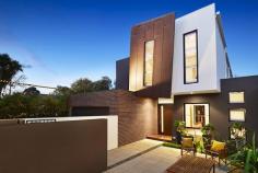 86 Wells Road, Beaumaris VIC Auction 10:30am, Saturday August 9, 2014   $1,295,000 - $1,395,000 3  B  2  b  2  C Watch property video A Statement of Style, Space & Design Get ready to impress with this up to 4 bedroom, 2.5 bathroom spectacular statement of architectural style boasting an exceptional sense of space & an innovative central entertainment zone designed to bring the outdoors in. Superbly positioned only two doors to Illaroo Reserve & pre-school, and a short stroll to the beach, Seaview shops & cafes, schools and the bus.  Beyond a striking copper façade & oversized pivoting door, warm Jarrah & polished concrete floors, expanses of glass & soaring voids define a beautifully balanced layout flooded in northerly light.  Vast living zones are connected to multiple outdoor entertaining areas including a sun drenched central courtyard with glass cafe-style sliders (pizza oven & pond), a private front courtyard with boxed Merbau seating & a shimmering black tiled pool set in rear landscaped gardens. A luxurious Caesarstone & stainless steel appliance kitchen with island bench, butlers' pantry, dual dishwashers & a built in Miele coffee machine is at the heart of inviting family (gas OFP), living & dining areas.  A ground floor study & powder room could double as guest quarters; and complements spacious upstairs bedrooms, 2 with a dual access bathroom & built in robes, and master with his & hers walk in robes and dual vanity, double shower en suite.  Impeccably appointed with all the extras including 3 metre ceilings upstairs & down, extensive storage, ducted heating, evaporative air conditioning, indoor/outdoor surround sound, intercom, security alarm, plantation shutters, Shugg windows, automatic blinds (for void), laundry chute, garden lighting, irrigation, gas pool heating and a direct home access auto double garage. For more information about this statement entertainer please contact Andrew Campbell at Buxton Brighton on 0419 366 545 http://www.86.wellsroadbeaumaris.com/ 