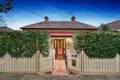 39 North Street Ascot Vale VIC 3032 In a leafy plantation street, this meticulously renovated three bedroom Victorian home with studio office, successfully blends period charm with modern day comfort. The open plan living space comprises a contemporary two-tone kitchen with stainless steel appliances, stone bench tops and family meals around the island bar, beside a formal dining space and adjoining elegant lounge. Accommodation is plentiful with three large double bedrooms fitted with generous robes, each with open fire place. The substantial main bathroom flaunts luxury, a large covered deck overlooking landscaped gardens allows for effortless entertaining, whilst the rear ROW leads into the double garage. Complete with polished floors, soaring ornate ceilings, pretty leadlight, alarm, heating, cooling, with tram, shops, restaurants and schools at your door, it's the perfect family package.   