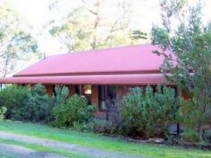 80 Arnolds Rd Barongarook VIC 3249 3.5 Acres &#150; 1.40 Hectares. With a north facing block 
in the sought Borongarook district, this quality country style 3 
bedrooms BV home is designed to capture the full beauty this area has to
 offer. Features include cathedral ceiling with exposed beams, brick 
feature walls in the open plan lounge/living area with solid fuel heater
 and sliding doors providing access to the extensive decking designed 
for summer outdoor living. Spacious kitchen ( elect. stove, dishwasher, 
crn. pantry) with sky light allowing full use of the natural light, 
dining area and work station. All 3 bedrooms have BIRs with access the 
large bathroom providing bath & separate shower. A unique 
feature this quality property has to offer is the large American barn 
style entertaining/games room with wood heater, kitchenette, toilet, 
powder room, spacious decking and pizza oven providing opportunity for a
 range of different uses. An established garden of native & English
 trees & shrubs, large orchard, lockup work shed (concrete & 
power), dams veggie patch and chook run. This unique property 
located in this private and tranquil setting at the end of Arnolds road
 with sensational views over the Otways will impress all. Price $439,500 