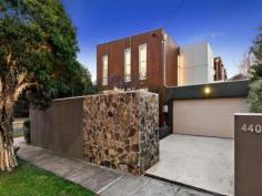 440 Hawthorn Road, Caulfield South, VIC 3162 A Stylish Spacious Indoor-Outdoor Oasis On the corner of Keeron Street and ideally suited to an enviable lifestyle of relaxed comfort, this light-filled town residence is the definitive example of stylish modern-day living. The intelligent architectural design encompasses walls of ceiling-height windows in both the formal & informal zones that invite the outdoors in. A quality Bosch/stone kitchen with central island bench looks onto the casual zone. Upstairs are three large bedrooms, two bathrooms (main ensuite) & a study/retreat. A landscaped front garden flowing from the living area, a beautiful private sun drenched alfresco deck leading off the dining/family area & a balcony off the master bedroom combine to add fabulous inside/outside liveability to this family-sized home. Further highlights include zoned ducted heating & cooling, alarm system, security video intercom, floorboards & a double remote garage with internal entry. Perfectly positioned near transport, this low-maintenance dream is also footsteps to Princes Park, local shops & cafes & is ready for you to move into with nothing left to do but enjoy.