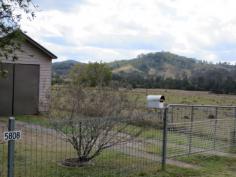 5808 Bruxner Hwy, Mummulgum This lovely home has amazing views of rolling hills and lush green countryside 
* Perfect for the motor homer or semi retiree with village style living 
with general store across the road and a great little community hall 
with many activities, primary school across the road 
* Positioned in a private position with a back verandah facing the view 
* Owner has done renovations in the last couple of years, with new 
bathroom, large loungeroom area, modern kitchen,seperate dining and 2 
bedrooms plus sunroom 
* Heaps of cupboard space,outside toilet,, solar panels with buyback power scheme, garage and garden shed 
* 5.5 thousand gallon tanks, large block with fruit trees and established gardens 
* A great Buy ! 