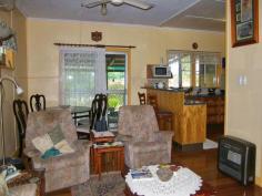  6 Adcock St Dalby QLD 4405 OPEN TO INSPECT SAT. 23rd AUG. 10.00 - 10.40 Here's your chance to buy into a tightly held position on the western side of town. This would make a great starter home or a valuable addition to your investment portfolio. All
 3 bedrooms are carpeted and have ceiling fans. The main bedroom is 
easily accommodates a king-sized bed, and bedroom 3 has a 
floor-to-ceiling built-in robe. The lounge/dining boasts beautifully polished timber floors and reverse cycle air-conditioning to beat the seasons. The kitchen has been updated to a modern country feel with plenty of cupboards, pantry & gas cooktop. The
 bathroom has also been updated in recent years to include a separate 
shower & tub, and is conveniently located between bedrooms 2 & 
3. Accessible from the dining room is the large covered & 
paved outdoor area overlooking the backyard. An adjoining shaded fernery
 complete with fishpond gives a private & tropical feel. Car 
accommodation for 2 vehicles is provided by an attached drive-thru 
carport plus a single garage with power and both have a roller door for 
security. Overall, this is an extremely solid and comfortable home and the location is unbeatable with no flood worries! You don't want to miss out on this one, so book your inspection now!     Energy Efficiency Rating:     0.0-star NABERS Energy Rating 