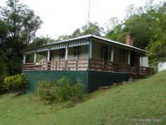  29-31 Mount St Kyogle NSW 2474 Lookout Views Positioned on over an acre of land (4287M2) with views second only to Kyogle's lookout. This home affords spectacular views of the town below and far into the distant ranges. High ceilings and wood panelling throughout, appealing to those looking for a home filled with character and country charm. Three spacious bedrooms are on offer, two of which have French doors opening onto the timber verandah. Three air conditioners provide cool or warm air ensuring utmost comfort throughout the year. The kitchen is less then 2 years old and the bathroom and laundry are neat and tidy. There is under home parking and storage and a garden shed for the tools. You will be seduced by the charms of this country home. 