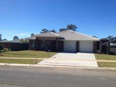  Lot 6b Melton Road, MUDGEE NSW 2850 This home is ready for you to move into now! Every time you drive into the driveway of your new home you will be impressed by it's grand facade. Much thought and design has undergone to produce this modern home which in fact is a dual residence. Hibbards are creating affordable housing, with this design both residents get the advantage of it's impressive appearance without the price tag that one would predict to be attached. These two dwellings are combined to create a magnificent looking home, yet each has it's own privacy and plenty of space to feel like it's all to yourself! The dwellings are joined by a common wall that has been built for safety and complete privacy. Dwelling A has a private and quaint entry at the side, and dwelling B has it's front door facing the road. As you walk through you will find this 4 bedroom home makes great use of space including the combined kitchen, dining and family room which then flows neatly out to the covered alfresco area and onto the private backyard. Each of the four bedrooms has built in wardrobes, with the master bedroom having it's own private en suite. The kitchen is a great workable space with a corner walk in pantry, and plenty of bench space plus a great breakfast bar. This is a neat package perfect for the first home buyer, investor or anyone looking for value in the real estate market.  Your home is situated at the top of south Mudgee, close to the golf course, Primary schools and Hospital. It is also located on the bus route giving you wonderful access to all that Mudgee has to offer. Your brand new home comes complete with - Easy-care Landscaped front & rear yard - Fully Fenced yard with side access gate - Bathroom accessories and durable floor coverings - Vertical Blinds - Energy Efficient Light fittings - Roof Insulation - Window locks & Fly Screens to all windows and sliding doors - Shelving and hanging space to ALL built in robes & Linen Press - Dishwasher - Fan Forced oven - Clothes Line - Garden tap to front & rear of house - 3000Lts Rain Water Tank and Pump - TV Antenna - NBN Lead in - Door Stops to all swinging doors - Letterbox - Remote Control Garage Door - Fully Lined Garage walls & ceiling - Hard Wired Smoke Detector/s - Electrical Safety Earth Leakage Circuit Breakers - Harmonious Interior and Exterior Colour Throughout - Home Owners Warranty Insurance - Hard Surface Driveway All you need to do is turn the key. Disclaimer - Artist impression. Floor plans, elevations, site plans, colour schemes and finishes to exterior may vary or change without notice - please check builder's plans when signing for purchase. 