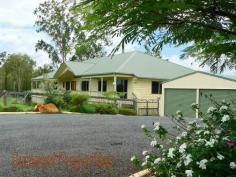 49 Anne Collins Crescent Mundoolun QLD 4285 True Country Living On 7 Acres Final Reduction - Now Only $725,000 A great big sprawling Queensland Colonial with views to Tamborine that really has it all – and is only 3 years old. The 7 acres that the home sits on is divided into 5 paddocks (3 large & 2 small), and has 3 Sheds, a dam, an animal shelter/shed, chook house, and quality fencing (some even dog proof). The home has 4 country sized bedrooms, 2 bathrooms and has verandah’s front and back to take in the truly outstanding views. On entering the home you are met with a massive dual living area with 12’ vaulted ceilings, polished floors, ironbark feature posts, a pot bellied stove especially designed for providing central heating. The vaulted ceilings extend through to the great entertainment area on the back veranda. This home has so much space it will take BIG Furniture. Adjoining the living area is a massive country kitchen with quality all the way. Beautiful rare granite bench tops with timber doors, a Fisher & Paykel induction stovetop,& oven as well as a Kleenmaid dishwasher. You’ll appreciate the 9’ceilings throughout the rest of the home especially in the four bedrooms as it makes for a very cool & spacious living as one should expect. This home although modern and almost new has a wonderful old-fashioned country ‘feel’ about it. This family residence also hosts a fully functional granny flat (or guest wing) with its own living area, kitchen, bedroom and (3rd) bathroom. The home also boasts ‘Crimsafe’ security screens on all the windows and doors. There is a massive storage area under the home big enough for trailers, boat, ride-on mower, and equipment. Much of this space is concreted. This is genuine a working rural property at its finest...Live the Dream! CLICK ON ANY PICTURE TO ENLARGE Situated in ‘The Mundoolun Estate’ that has Over 300 Acres purely dedicated to Wildlife Corridors and Parklands, and is well known for its quality of housing. Each Acreage Property has Town Water, Underground Power & Phone, and Tree lined Kerb & Channelled roads. Just a short drive to the thriving Jimboomba town centre; there you’ll find a fine array of Shops & Café’s including Woolworth’s, Coles, Bakers Delight, Mitre 10, the Post Office, Takeaways and much much more. Only 45 minutes to both Brisbane and the Coast. A copy of the “Sustainability Declaration Statement” for this property can be viewed at our office situated at lot 1 John Collins Drive, Mundoolun. Please call (07) 5546 9093 for our office hours. For an inspection please call (07) 5546 9093 Property Information     Area: 7 Acres     Bedrooms: 5     Bathrooms: 3     Garage Spaces: 4 