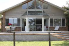 221 Annetts Parade Mossy Point NSW 2537  Holiday Rental $1,300-$2,800 This delightful and recently refurbished beach house is located on the riverside reserve along the Tomaga River estuary at Mossy Point. It has a north easterly aspect and tranquil views of the river from all living areas. It is a leisurely and pleasant walk along the reserve to a safe and lovely surfing beach with an adjacent tidal lagoon that is ideal for young children. Small craft can be moored and launched into the river directly in front of the house and a structured boat ramp is located a few hundred metres away nearer the river mouth, alonside a string of jetties and boatsheds. The accommodation is stylish and comfortable with three bedrooms, two full bathrooms, an extensive and sunny living/dining/kitchen area with views of the river, a den for television and reading and an additional living area upstairs with enhanced views of the river. There is coverev parking for two cars and a barbeque housed in a weather protected courtyard, adjacent to the house and a separate laundry/storage room. Mossy Point is located on a picturesque headland between Bateman's Bay and Moruya, about four hours drive south of Sydney and two hours drive east of Canberra. Moruya airport is ten miuntes south with services to and from Sydney, Melbourne and Merimbula. Land-linked Broulee islan, the vast South Broulee beach and many small bays and inlets form part of the local coastline, offering wonderfu; opportunities for fishing and walking and other outdoor activities. 'The Muffin Shop' the local cafe and gallery, is a few minutes walk from the house. Essential items and other services can be obtained in Broulee village, behind the beach. High Season- Weekly/ $2800Weekend/ $800 Mid Season- Weekly/ $1800Weekend/ $600 Low Season- Weekly/ $1300Weekend $500 PROPERTIES ARE FULLY EQUIPPED EXCEPT FOR BED, TABLE & HOUSE LINEN PROPERTY FEATURES     Total Beds: 4     Balcony     Utensils     Dishwasher     DVD Player     Freezer     Microwave     Refrigerator     Toaster     Washing Machine