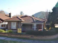 28 Ordnance Ave Lithgow NSW 2790 "COO-EE" - A STATELY BRICK RESIDENCE Enjoy the prime location in tightly held Ordnance Avenue and the history preseved in this well kept full brick home. The modern touches add comfort but decorative pressed metal ceilings, bay window seats and parquetry floors all give you the feel of a bygone era. The home is centrally heated with natural gas, has a Tasmanian Oak kitchen with walk in pantry, separate living, dining and family rooms and a modern tiled bathroom. The real bonus with this one is the self contained 1 bedroom flat off the triple garage which features a kitchenette, ensuite and small living room. The yards are fully fenced and have established gardens. A rare offerring to the market in this absolute prime residential area.   Property Snapshot Property Type: House Aspect Views: North aspect at the rear Construction: Double Brick Zoning: Residential House Size: 181.00 m2 Land Area: 632 m2 Features: Close to schools Dining Room Dishwasher Established Gardens Family Room Fenced Back Yard Fully Fenced Yard Lounge Parquetry Floors Storage Verandah