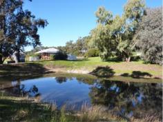  24 Country Rd Gidgegannup WA 6083 GREATLY REDUCED TO SELL - STRICTLY BY APPOINTMENT You will be very impressed with this Rural Building home built in 2001, situated on 11.71 acres of lush pasture with bore & 2 gorgeous dams - 1 spring fed!PERFECT FOR YOUR EXTENDED FAMILY! Both homes are top quality with a neutral decor, high ceilings, good sized floor plans, wide verandahs all round & double carport to separate the two. Ideally located just 15 minutes to Midland CBD via Toodyay Rd, with Gidgegannup Primary school 5 minutes away, this represents top value buying. The orange tree-lined driveway and the immaculate presentation of the entire property will charm you, as will the six lush paddocks & permanent water supply. All fencing & gates are top notch, the 30 x 40ft shed is spacious & powered, and there is nothing to do than move in, sit back & relax. Whether it is Gran & Pop or older kids you need to accomodate, you will be well pressed to replace this at this cost! These brick & iron homes feature the main home with 3 bedrooms, 1 bathroom, lounge/ dining & kitchen open plan, activity room or study with laundry & separate wc, whilst the granny flat has 2 bedrooms, bathroom & laundry together & separate wc. Both have Thermo Duk insulation,they share a solar hot water system, both have electric cooking, with 1 x split system air conditioning unit each.The main home also has a wood fire which doubles as an oven! Owners are keen to negotiate a deal & are wanting to travel! Please call Jan to inspect on 0408 915 281 