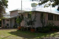  GOONDIWINDI, QLD, 4390 This solid cottage with 2 bedrooms and an enclosed sleepout is just oozing charm and character Both bedrooms open onto a delightful sunroom that just soaks up the winter sun. A large lounge in the centre of the home opens onto the enclosed verandah that is spacious enough to be used as a third bedroom. A separate small office runs off the dining area that adjoins the well laid out and compact kitchen that boasts a large pantry and room for a large refrigerator. The bathroom is quaint with the shower over the bath and a separate toilet. A lovely paved entertaining area is at the rear of the house set amongst an established garden. The yard is well fenced and has a large three bay shed. This delightful little home won't last long.   