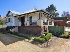 109 Kirkwood Street, Armidale, NSW 2350  This
 lovely elevated home is perfectly positioned for city living. It boasts
 stunning views across the city and creeklands and is just one block to 
the shopping centres and coffee shops. Its close proximity to schools, 
CBD, parks, clubs and sporting fields makes this a convenient family 
home. Features include: Four bedrooms - all inc. built-ins and original fixtures Spacious foyer and hallway with double linen cupboard Main bathroom inc. shower, claw-foot bathtub, vanity and toilet Second bathroom off the main bedroom with shower, basin and separate toilet North facing family room with french doors opening to timber deck Modern kitchen with excellent bench and cupboard space plus dishwasher, gas cooktop and under bench oven Space saving laundry with good storage Four carports Ideal block size - 1268m2. Rates $2245 per annum Currently tenanted until Oct 2014 @ $435.00/week This
 home features original polished floorboards throughout and a neutral 
colourscheme. The backyard includes garden shed, rainwater tank and 
mature trees. Call today to arrange your inspection. 