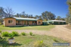  13 stringy bark ridge road armidale This lovely elevated home
 is perfectly positioned for city living. It boasts stunning views 
across the city and creeklands and is just one block to the shopping 
centres and coffee shops. Its close proximity to schools, CBD, parks, 
clubs and sporting fields makes this a convenient family home. Features include: Four bedrooms - all inc. built-ins and original fixtures Spacious foyer and hallway with double linen cupboard Main bathroom inc. shower, claw-foot bathtub, vanity and toilet Second bathroom off the main bedroom with shower, basin and separate toilet North facing family room with french doors opening to timber deck Modern kitchen with excellent bench and cupboard space plus dishwasher, gas cooktop and under bench oven Space saving laundry with good storage Four carports Ideal block size - 1268m2. Rates $2245 per annum Currently tenanted until Oct 2014 @ $435.00/week This
 home features original polished floorboards throughout and a neutral 
colourscheme. The backyard includes garden shed, rainwater tank and 
mature trees. 