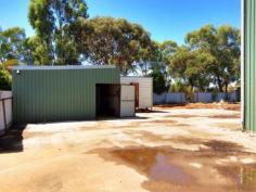 39 Fishburn St Cowra NSW 2794  The property is in an I2 Zone and has further development potential. A
 level, well fenced block in Fishburn St (a popular area for Light 
Industry), offering 1.88 HA (4.6 acres) in area & comprises a 93m 
frontage & 200m depth with 2 access points. Power, Phone and Water 
are available. Main shed constructed of steel frame and colorbond
 cladding and roof. It has a concrete floor, 3 large roller doors and 
one PA door. Adjoining this shed is a built-in weighbridge. 2nd shed is 
used for an office / staff area and is also colorbond construction. 
There is also an amenities modular building. (shower, hand basin, 
toilet) Call for more details. 0418 699080 Wayne Heilman   Property Snapshot Sale Price: By Negotiation Building Area: 250 m2 Site Area: 2 ha Property Type: Light Factory Uncovered Parking: 10 Total Parking: 10 Features: Container Access Heavy Vehicle Access Shower Vacant Possession Vehicle Access 