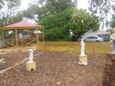 36 Bayley St Coolgardie WA 6429 IVORY'S CORNER - CHARACTER HOME $275,000 You will fall in love with this gorgeous character home in Coolgardie. Set on 1012sqm this heritage home built in 1896 was once know as "Ivorys Corner" and is complete with stained glass windows, picture rails and 14 foot high ceilings. Features of this property are 2 bedrooms, modern kitchen, meals area, lounge room, activity area, additional sitting room in back of house, split system air conditioner to lounge room and main bedroom, alarm security system, verandah to front, side and back, big patio with built in BBQ, 2 large worksheds plus smaller garden shed, large rain water tank. There is also a free standing gazebo which is great for entertaining