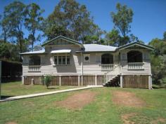  Blackbutt QLD 4306 This Queenslander has original features, and was fully renovated in 2010. It has 3 bedrooms( 2 with built-ins) set on 1128m2 town block with all amenities and close to the school.The original features include high VJ timber ceilings, polished flooring with a wood heater, VJ walls throughout, with decorative timber features and stained glass french doors leading to an expansive verandah.The lounge & dining room both open out onto the verandah & into the family/sleepout room. A lock up garage , for a single car is at the front of the property. The laundry has a 2nd toilet & vanity , with a small veranda with french doors to the master bedroom .It is currently rente on a month to month basis. 