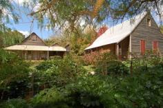  The Gunyah Odessa St Berrima NSW 2577 Beautifully restored and updated without losing any of its charming 1880’s country ambience, “The Gunyah” is a masterpiece in conservation. • Slab construction with iron roof • Original home consists of cosy sitting room with open fire • Separate dining room with wood fire • Two bedrooms and two bathrooms • Country kitchen with Aga stove • Sunroom • Perfectly matched additional wing comprising master bed/sitting room with ensuite • Free-standing storage/office space with covered verandah • Lovely established trees and gardens, large dam (and permanent spring water) vegie garden and chook house Unique and inviting, the property is just a short distance to the historic Berrima village with its excellent restaurants, shops and local attractions. 