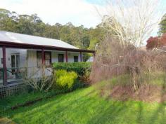  385 Liena Road Mole Creek TAS 7304 Situated in Mole Creek with the Sassafrass Creek as the back boundary is this unique property with 2 dwelling. The main stone, brick house has polished timber flooring throughout the spacious open plan living, 2 good sized bedrooms, bathroom, separate toilet and laundry. Features some stained glass windows, french doors, lovely stone open fire place, wood heater, gas hot water and solar panels. The second dwelling is a quaint cottage with 2 bedrooms, kitchen with combustion and electric stove, lounge and bathroom. Outdoor is 2x double garages, storage shed, orchard and fully fenced. This is a must see property. 