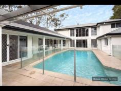 4 GAYNA STREET, KENMORE EXECUTIVE POOLSIDE ENTERTAINER Busy professional families will adore this modern feel and generous size of this special two level residence located in a secluded cul de sac.  The convenience, so close to shops, buses, schools and ability to commute north and south of the CBD makes this a perfect family option.  Designed with the pool as the central showpiece and loads of glass to capture cross breezes and natural light.  With 2 large bedrooms upstairs separated by a breezeway and adjacent to the third bathroom. While the main suite with ensuite and generous walk in robe plus fourth bedroom near the second bathroom is on the ground level.  The home office is a superb size and well located.  The large lounge and dining can be separated from the other lounge. It also leads out to the poolside patio and looks to the trees on the other side.  The beautiful kitchen is exceptionally spacious and has raked ceilings, island bench, rich timber floors and is open to the large family room and casual meals area.  There is a private covered deck on one side and more sliding doors leading to the entertaining area with high umbrella.  There is loads of storage plus a 3 car lockup garage straight in from the street.  Great value and immaculate presentatioD