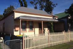  3 Young Road, Broadmeadow NSW 2292 Retaining all its old world charm this home offers a great opportunity to return it to its original beauty plus some. With 3 (three) large bedrooms, a wide central hallway leading to a roomy living room and kitchen and the bathroom at the rear. Original features include 12 foot high, ornate timber ceilings, 2 fireplaces, dado walls throughout, verandahs front and rear. The kitchen and bathroom, whilst quite functional, need a bit of work. However we would anticipate this section of the home will undergo some degree of renovation. Quite spacious 358sqm block with full rear lane access adds to the potential to later include double garaging but at present offers off street parking. Situated quite handy to bus transport, railway station and the cafe's that are in abundance in this popular location. 