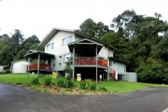 “IVORYWOOD”, BUNYA AVENUE, BUNYA MOUNTAINS QUALITY 2 BEDROOM CHALET STYLE UNIT IN THE HEART OF THE BUNYA MOUNTAINS SITUATION: Unit 9/1 Bunya Avenue, Bunya Mountains. AREA & TENURE:164m2 (Freehold) LAND: Above road level, property fronting Bunya Avenue with rain forest surrounds and views. IMPROVEMENTS:“Ivorywood” is a two storey unit as part of a complex of 10 units. Unit 9 is part of a Building of 2 units. The
 unit ground floor comprises open plan kitchen/dining/lounge room, 
laundry, toilet and deck. The lounge has polished floors and a wood 
heater. The upstairs floor features 2 bedrooms, main bathroom and 
ensuite (with spa bath). The living area has an area of approx 93.8ha. 
Ground Improvements Include a septic system, 22500 litre Colour bond 
tank, pump and one car parking space in the carport. 