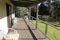  2441 Bucketts Rd  Gloucester NSW 2422 5 Bedroom home on 3 acres only 20 minutes east of Gloucester on the Bucketts Way. Immaculate presentation throughout this home which is surrounded by neat gardens and views to the creek and bush at the back of the property. Plenty of sheds, lots of rainwater, easy access and a convenient location make this a great package. The home features a well appointed kitchen, 2 living areas, 2 bathrooms, 2 air conditioners, a wood fire, a full length verandah and a screened sunroom. 