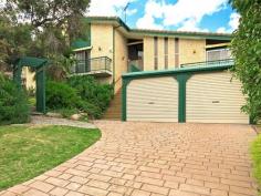  20 Roundaway Crescent O'Halloran Hill SA 5158 Designed over 2 levels this large 4 br home blends elegant entertaining with relaxed family living. The main bedroom has an ensuite bathroom and walk in robes. The spacious formal lounge and dining has lofty raked ceilings and direct balcony access, the kitchen with ample cupboards is adjacent to a 2nd meals area which opens through to an additional living area to the sensational extensive all weather outdoor living and BBQ area. Downstairs there is a wine cellar and a large games room for billiards or table tennis or possibly even a home theatre etc (alternatively it is an ideal option as a home office with completely separate access), there is undercover lockup parking for 2 cars, plus additional off street parking. Heating and cooling is well catered for with refrigerated reverse cycle ducted air conditioning plus a slow combustion heater in the formal lounge as well as additional split system air conditioning. To arrange an inspection contact Kevin J Barry.   