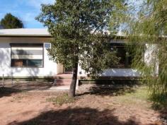  21 Bolitho St Port Augusta SA 5700 A GOOD START! Located on a corner allotment, this 3 bedroom home will certainly suit those wishing to purchase a property at a very realistic price. The home was built in 1969 and has been in the same family every since, but the time has come to move on. The kitchen is roomy enough, with plenty of overhead cupboards and lots of bench space, and it adjoins the dining area. The lounge is especially large as it has been extended to incorporate a beaut little sunroom or study area. The yards are of exceptional size, with the rear having a lawn area, trees and shrubs, and another area completely fenced off - ideal for a vegie garden or chicken pen. The shed is approx 10m x 4m - ideal for the handyman, and has a room attached, which can be utilised as a storeroom or even a sleepout. Air conditioning throughout, and on a great sized allotment of 814m2, this will suit those wishing to enter the investment market 