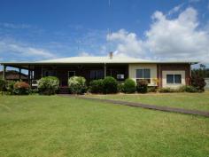  Tully QLD, 4854 There's room for everyone in this spacious modern farm house in Kennedy featuring 5 bedrooms, 2 bathrooms, spacious living room with laminate floors, roomy kitchen with dishwasher, work island for preparing food, pantry, tile countertops, fire place, inside laundry, home office, laundry tub, carpet in bedrooms, 3/4 wraparound deck, fully air-conditioned, security screens, lush garden, a manicured lawn, white picket fence. 