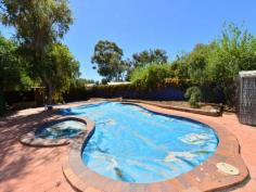  40 Angguna Avenue Braitling NT 0870 Family friendly This neat and attractive residence offers space for the family that likes to entertain. Features include a lounge room with combustion stove and floating timber floors. Adjacent to this room is the open plan kitchen and a spacious dining area which has access via sliding doors to the undercover outdoor living area and the sparkling in ground pool. The four bedrooms feature built in robes and the main bedroom is spacious. A study or fifth bedroom is off the lounge room and has its own access. The bathroom is generous in size and features attractive tiles, a bathtub and separate shower. Other features of this home include reverse cycle air conditioning throughout, double under cover car parking, established gardens, garden shed and solar hot water. General Features Property Type: House Bedrooms: 5 Bathrooms: 2 Land Size: 931 m² (approx) Indoor Features Ducted Cooling Air Conditioning Outdoor Features Carport Spaces: 2 Other Features Inground Pool, Outdoor Living, Study/Office, Verandah 