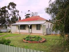  5 - 7 Compston Street, Goroke VIC 3412 Attractive home on 0.4 ha block in Goroke township 	Lounge with wood space heating, ceiling fan and ducted air con. 	Bright kitchen with gas range, range hood, B.I.C's, freshly painted 	3 bedrooms, 2 with ceiling fans and ducted air con, 3rd. with ref air con 	Bathroom with bath and vanity 	2nd bathroom/laundry with shower recess and heater fan. 	Undercover decking plus BBQ/ fernery area. 	18' x 20' double garage with power. 	Garden shed, bird aviary, chook shed and fruit trees 	As new Solahart hot water system. 	Large rainwater tank and pressure system. Ideal property for a horse or small rural enterprise and close to main street and P12 school. Other features: Close to Schools,Close to Shops,Formal Lounge 