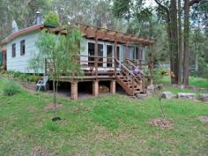  130 Sternbeck Lane Bucketty NSW 2250 Quiet Bush Acres with Horse Paddocks - 25 Acres Lovely rural property, situated on quiet bush lane, with two bedroom country cottage, plus paddocks and shedding for horses. The pleasant cottage has a large living area with combustion fireplace, timber floorboards, ceiling fan and glass doors opening onto a large verandah overlooking the horse paddocks and rural bushland views. The bedrooms are king sized and the main bedroom has an annex with bathtub. The cottage is constructed of hardiplank with steel frames and roof. There is electricity, phone, satellite TV and broadband, and a 5000 gallon water storage tank plus smaller tank off the shed. Good storage with single garage, tack room, tractor bay, feed storage area, round yard and horse/float shelter. The land is gently undulating with around half the land arable and divided into various paddocks with well draining sandy loam soils and spring fed dam. Bucketty is situated around an hour from the northern suburbs of Sydney and is a quiet rural bush community. Around 10 to 15 minutes from local cafe/general stores, local primary school, doctor, Produce and irrigation supplies and around 40 minutes from Tuggerah or Gosford. General Features Property Type: Lifestyle Bedrooms: 2 Bathrooms: 1 Land Size: 10.12ha (25.00 acres) (approx) Price per acre: $18,760 Indoor Features Floorboards Broadband Internet Available Outdoor Features Garage Spaces: 1 Deck Shed Land Features Fencing: Fenced Paddocks Soil Types: Sandy loam Carrying Capacity: 2 - 3 horses 