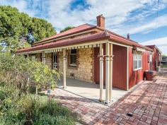  40 Hopgood Road Strathalbyn SA 5255 'Hopgood House' is an historic limestone, return verandah homestead of 3
 bedrooms plus store/study on 4.001ha or 9.88 sprawling acres with the 
big bonus of another character cottage. How good is this - It's two for 
the price of one! The main home comprises an upgraded kitchen 
with quality appliances and sparkling bathroom with freestanding claw 
foot bath and combination laundry which are highlights of this immensely
 appealing character home. The casual living area and the more formal 
dining room both have separate reverse cycle air and cozy wood 
combustion heaters for your comfort and convenience. Master bedroom 
features a generous walk in robe. Outside is a combination of 
pleasure and practicality with an 8m x 5m undercover entertaining with 
pot belly stove plus double carport & 10m x 6m fully enclosed 
shed/workshop. Undercover sitting area that oversees the backyard 
playground and chook run all combine nicely to make this not just a 
house but a family home. At the rear of the property sits the 2 
bedroom settlers cottage with quaint kitchen, entrance area and combo 
bathroom/laundry plus other stone and iron outbuildings oozing with 
character from yesteryear. Added features include a small air 
craft hangar, shearing shed, combo cattle/sheep yards, mains water 
connection and ample rainwater storage plus brand new boundary fencing 
complete this lifestyle package with the lot. 