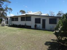  21 Albert Street, Jandowae, QLD, 4410 HOUSE + 5 ACRES ON THE EDGE OF TOWN This timber home is positioned on the western edge of Jandowae township on 2.14 hectares. There is room for everybody and everything. The acreage as a whole is fully fenced, has a small dam, town water connected and rain water tanks for extra water storage. It would be ideal for a family to have their ponies or motor bikes. Features include: * 3 large bedrooms * Family bathroom with the shower over the bath, vanity & toilet * Lounge room * Large eat in kitchen/dining room with combustion & electric stove, loads of cupboard space + pantry * Great easterly sun room to catch the morning sun * Double lock up garage with power connected * Downstairs entertaining area again with combustion stove for winter heating * Large laundry There are numerous out buildings for the chooks or small animals plus a great fern house. For further information contact the agent Warren Barker on 0429 893 099. 