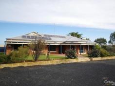  105 Hackett St Cookernup WA 6220 THE KING OF COOKERNUP If Cookernup had a king this is where he'd hang out, with his extremely happy family living in his king size home on his king size block with his king size sheds.  This home is the perfect set up for a big family in search of lots of space with a relaxed, peaceful semi rural location, and peace and tranquility is something Cookernup has in spades!!  Cookernup must be one of WA's best kept secrets; only about 10 minutes from Harvey and with a general store plus the convenience of the school bus run the residents here enjoy a whisper quiet rural lifestyle while still having the benefit of being surrounded by a friendly close knit community.  It wouldn't be right to enjoy this near perfect location if you didn't have the home to match and while the only true way to appreciate this property is to inspect it here are just some of the features that make this house a real king's domain.  5 Bedrooms in total with an Office/6th Bedroom and 2 Bathrooms  3 are Queen Size with BIRs  1 King Size Bedroom with BIRs  And the Master Bedroom which is just huge with Ensuite and WIR  Enormous Theatre/Formal Lounge room with complete with Projector, Screen and Surround Sound System  Massive Country Style Kitchen overlooking the Huge Open Plan Family Room comprising of Meals, Lounge and Games Area  Great Patio Entertainment Area with views over the rear Paddocks  Outdoor Spa and Decked Pool Area  Fully Fenced Yard  3 Kilowatt Solar System  Double Garage  17m x 7.5m Powered Workshop  9m x 6m Powered Workshop  130,000 litre water tank plus a second 40,000 litre tank.  This property simply must be inspected to be fully appreciated so call Brent today to arrange a suitable time.  