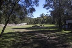  915 The Entrance Rd Wamberal NSW 2260 One Acre - Main Road Exposure House - Property ID: 728097 Level, one acre lot surrounded by council reserve land with direct main road exposure. Less then one kilometre to beach. Three bedroom elevated home with large machinery shed. 