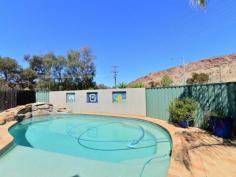  4/16 Bradshaw Drive Gillen NT 0870 With prime elevated views of Heavitree Gap as well as panoramic East and West MacDonnell Range views it will be hard to stop looking.  This two bedroom first floor unit has all the trappings of the ground floor units without a private yard. There is still plenty of common area to enjoy a social BBQ, swim in the pool or just read a book in the resort style garden setting. The entire unit has vinyl flooring and ducted evaporative air throughout. Open plan living is the theme in the lounge, dining and kitchen areas while the bathroom has a bath, shower and toilet. A real bonus with this unit is a 12m x 6m insulated shed that has had a lot of detail added to the inside. Divided into sections to accommodate a garage, a storage area and a games room/studio it is still diverse enough to cater to an individuals specific needs.  The grounds are immaculate and recent kerbing, bitumen & line marking make private off street parking a breeze.  Priced to sell to either the astute investor or happy home owner. 